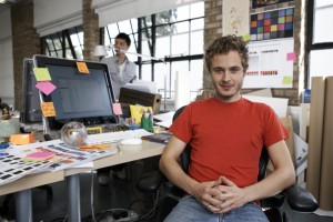 Portrait of a young designer in his office